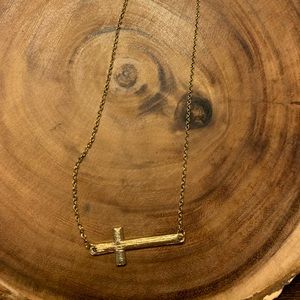 Cross necklace. Gold color.